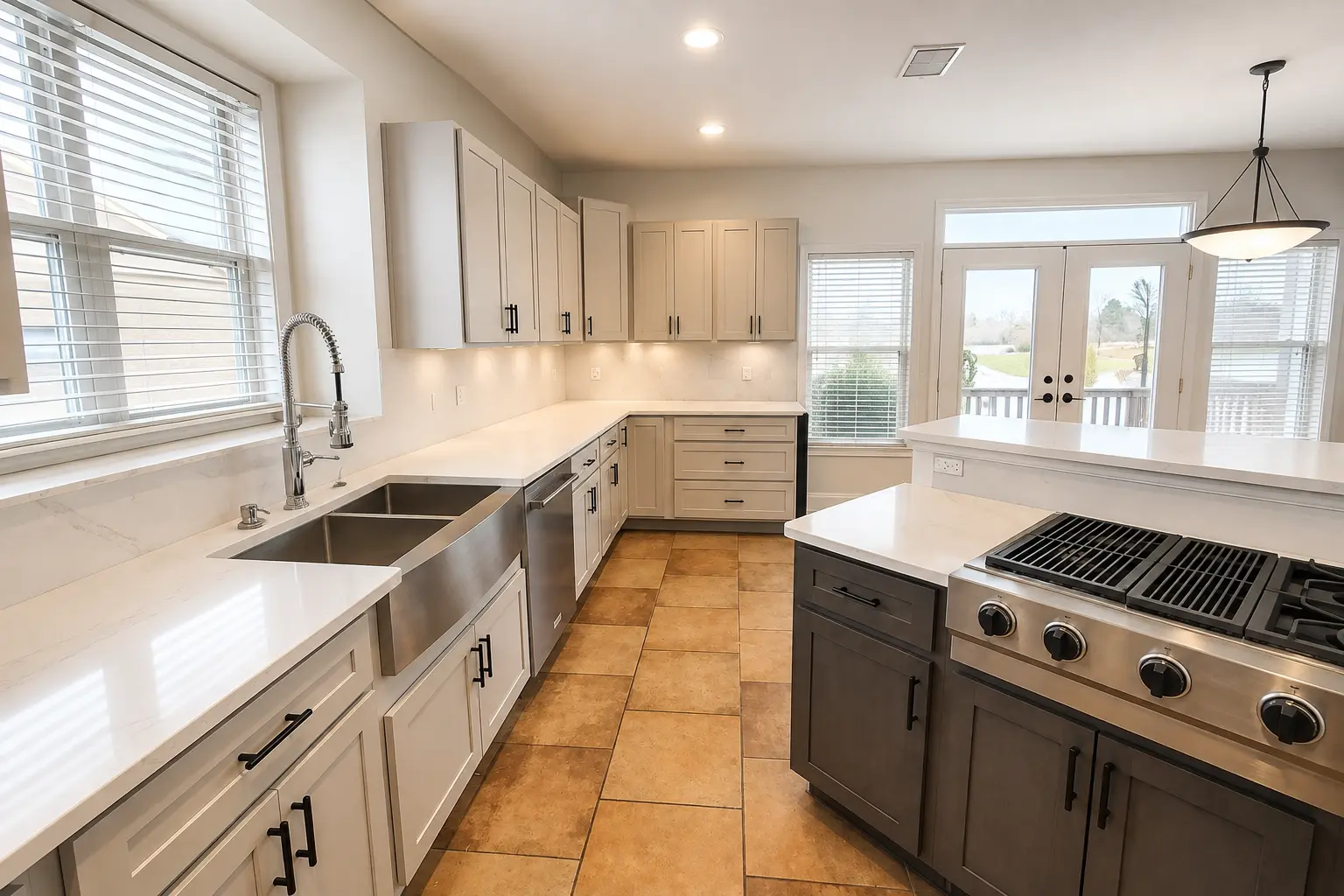 Finished kitchen with light cabinetry, white countertops, dark hardware and a stainless steel apron sink